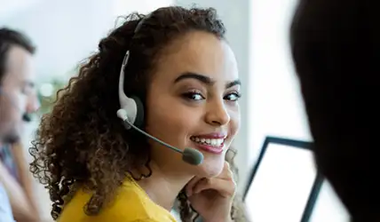 JFW customer service agent helping a customer on the phone.